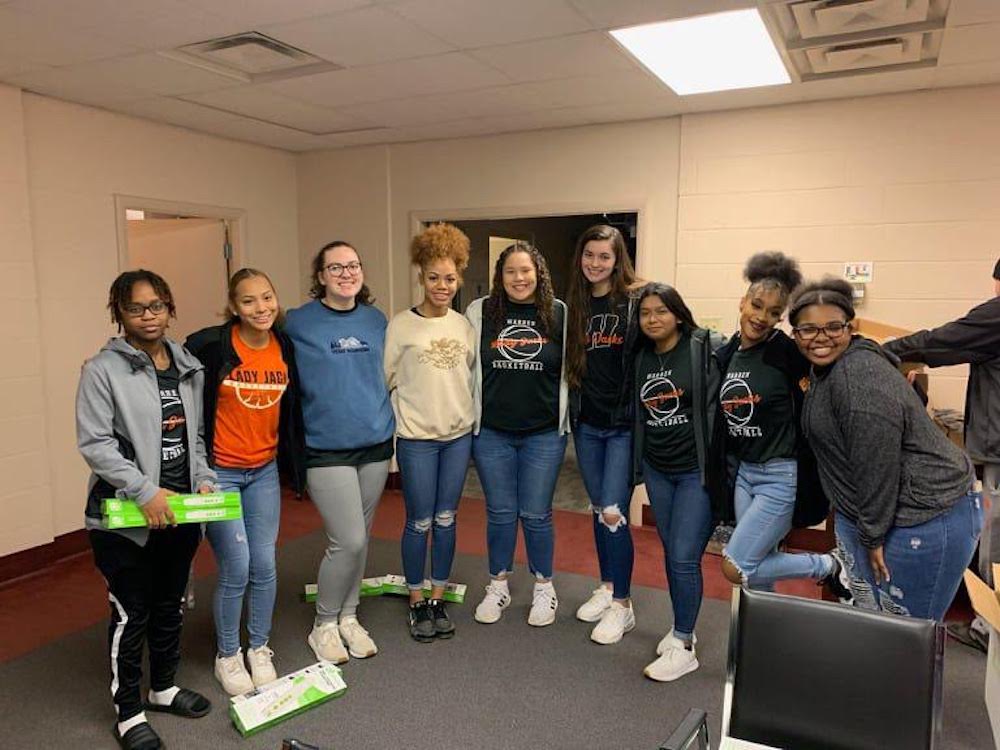 Lady Jack Basketball team takes time out of holiday break to give back to Warren