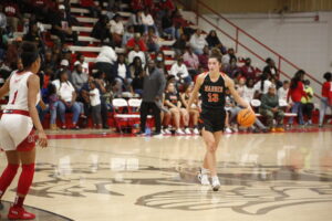 A person is playing basketball on the court