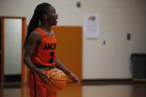 A person holding a basketball in their hands