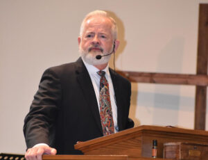 A man with a beard and mustache wearing a suit