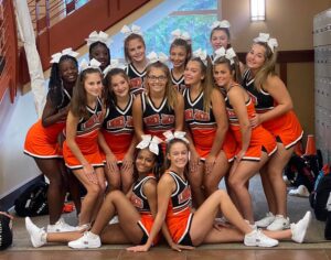 A group of cheerleaders posing for the camera.