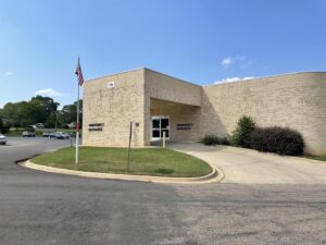 A building with a flag on the corner of it