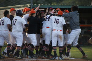 A group of baseball players celebrating with one another.