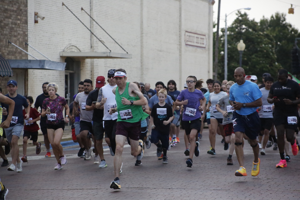 Runners and walkers take part in the Annual Pink Tomato Festival 5K Walk/Run