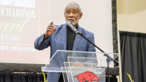 A man standing at a podium speaking to an audience.