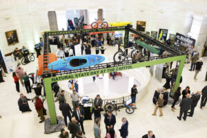 A crowd of people standing around a building.