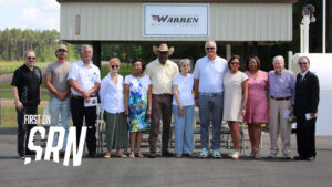 A group of people standing in front of a building.