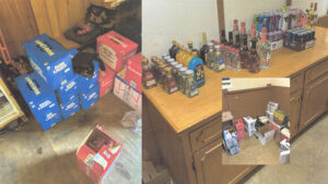 A bunch of liquor bottles and boxes on the floor